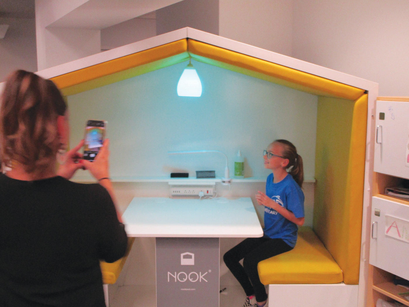 LEARNING NOOK: Fifth-grade student Ava Chiarello demonstrates the learning nook that is part of the new Learning Community wing at Eden Park Elementary School.